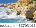 Ocean waves splash against beach with rocks background, Cliffs in the sea, Top aerial view of Cyprus, Nature Background with Sea, Vacation and relax 86703198