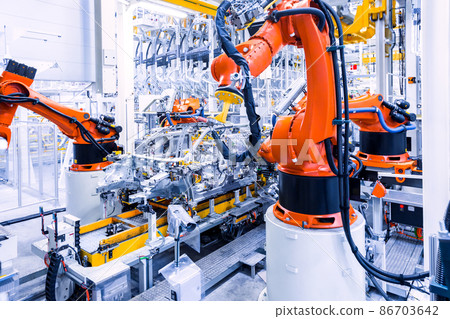 robots in a car plant robots in a car plant 86703642