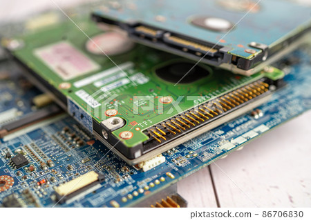 Technician repairing inside of mobile phone by soldering iron. Integrated Circuit. the concept of data, hardware, technology. Technician repairing inside of mobile phone by soldering iron. Integrated Circuit. the concept of data, hardware, technology. 86706830