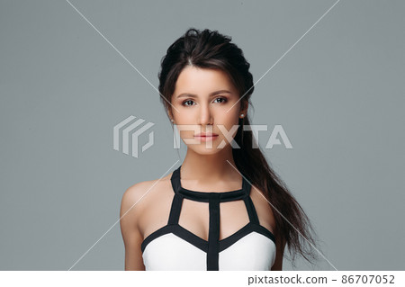 Peaceful lovely woman with long hair Isolated on Peaceful lovely woman with long hair Isolated on 86707052