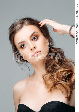 Young pretty woman with brooding look Isolated on 86707127