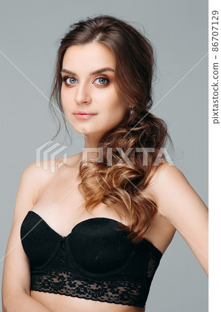 Young pretty woman with brooding look Isolated on 86707129