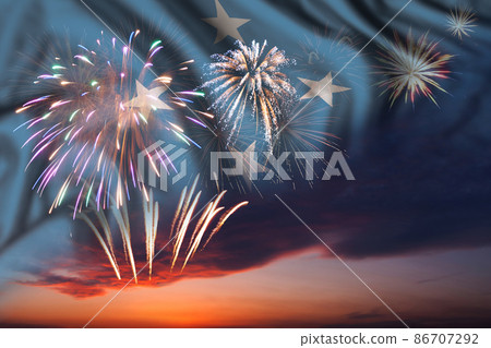 Fireworks in evening sky and flag of Micronesia Fireworks in evening sky and flag of Micronesia 86707292
