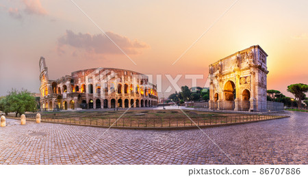 The path between the Arch of Constantine and the Coliseum at sunset, Rome. Italy 86707886