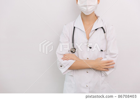 Doctor with stethoscope in medical coat on white background. Front position half body without head. Horizontal panoramic composition. Medical industry concept. Nurse in uniform healthcare concept. Doctor with stethoscope in medical coat on white background. Front position half body without head. Horizontal panoramic composition. Medical industry concept. Nurse in uniform healthcare concept. 86708403