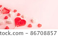 Pink romantic holiday backdrop with heart-shaped sweet candies. Decorative card for St. Valentine's Day with space for text. 86708857