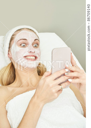 Portrait of moisturizing clay mask for medical design. Woman skin procedure. 86709140