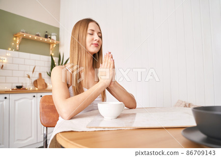 Young woman posing at kitchen. Home vacation portrait. Blogger. Alone interior Young woman posing at kitchen. Home vacation portrait. Blogger. Alone interior 86709143