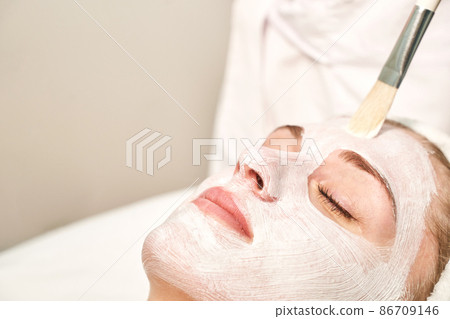Portrait of moisturizing clay mask for medical design. Woman skin procedure. Portrait of moisturizing clay mask for medical design. Woman skin procedure. 86709146