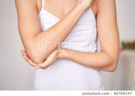 Young woman at office. Tired elbow. Female stress lifestyle. New normal 86709147