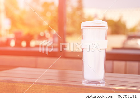 Drink beverage outdoors. Buy takeaway coffee in own cup. Ecology concept 86709181