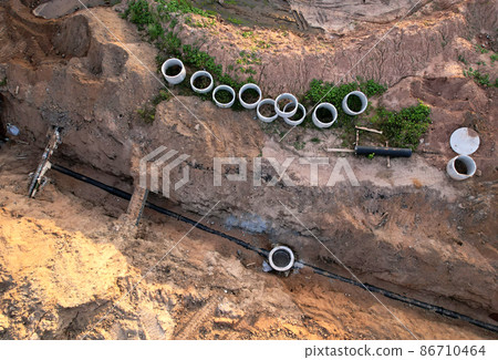 Laying of underground storm sewer pipes and sewerage well. Laying of underground storm sewer pipes and sewerage well. 86710464