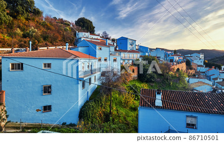 Picturesque hillside famous Juzcar town Picturesque hillside famous Juzcar town 86710501