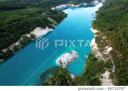 Artificial lake in a chalk quarry in Belarus at Krasnoselsky. Artificial lake in a chalk quarry in Belarus at Krasnoselsky. 86710797