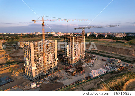 onstruction site with tower cranes during conctruct the high-rise building.  86710833