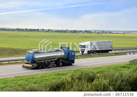 Isothermal Tank truck driving on highway. Isothermal Tank truck driving on highway. 86711536