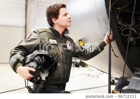Up we go. A pilot on his way into his plane. Up we go. A pilot on his way into his plane. 86712151
