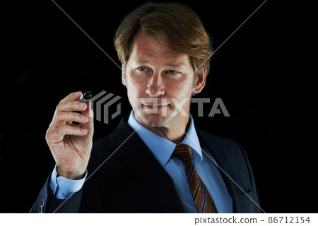 Time to chart my business plan. Cropped shot of a businessman holding a marker pen. Time to chart my business plan. Cropped shot of a businessman holding a marker pen. 86712154