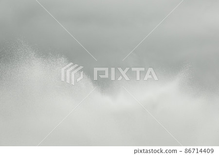 Splashes of water fountain movement of liquid flow against the gray sky background Splashes of water fountain movement of liquid flow against the gray sky background 86714409