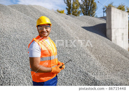 Photo of happy male multiethnic worker in plant 86715448