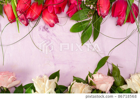 Row of tulips on wooden background with space for message. Mother's Day background. Top view Row of tulips on wooden background with space for message. Mother's Day background. Top view 86718568