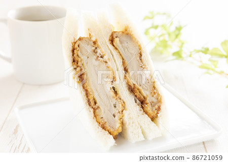 Delicious chicken cutlet sandwich and hot coffee 86721059