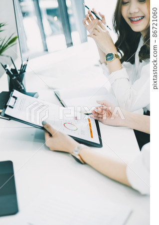 Close up hand of Asian accountant team working audit budget and finance of company on wooden desk in office. consult, business, tax concept. 86721060