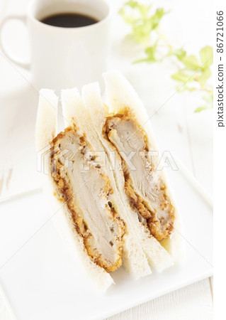 Delicious chicken cutlet sandwich and hot coffee 86721066