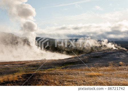 Landscape of hot zone with smoke in Yellowstone. 86721742