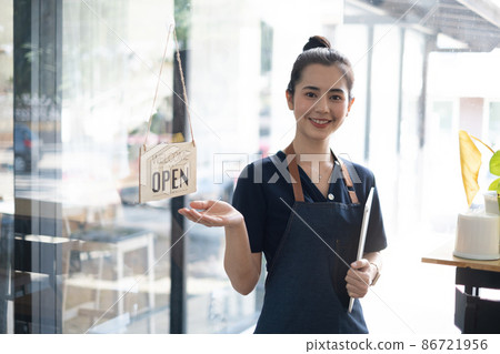 Portrait of asian woman barista cafe owner smile while cafe open. SME entrepreneur seller business concept. 86721956