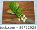 Wood grain cutting board and princess turnip 86722928