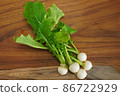 Wood grain cutting board and princess turnip 86722929