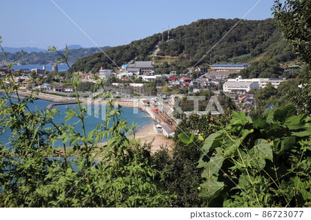 Train going along the coast Iyo Railway Takahama Line Matsuyama City Ehime Prefecture Shikoku 86723077