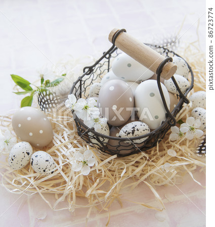 A basket with Easter eggs A basket with Easter eggs 86723774