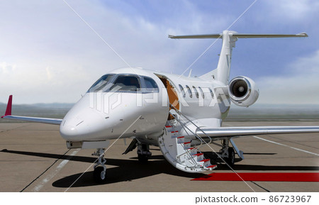 Private jet with red carpet in open airfield 86723967