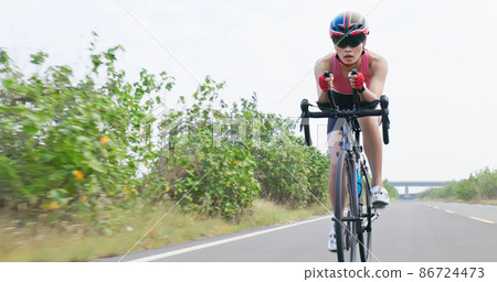 Asian young woman ride bicycle Asian young woman ride bicycle 86724473