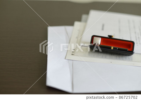 Resume / envelope / seal placed on the desk 86725702