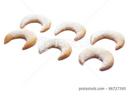 Traditional German or Austrian Vanillekipferl vanilla kipferl cookies isolated on white background Traditional German or Austrian Vanillekipferl vanilla kipferl cookies isolated on white background 86727395