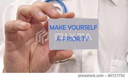 Make Yourself A Priority the text on the card in the man's hand Make Yourself A Priority the text on the card in the man's hand 86727792