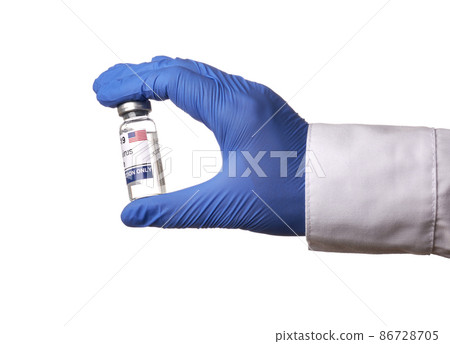 Gloved Hand Shows American Vaccine Vial - Isolated Photo 86728705