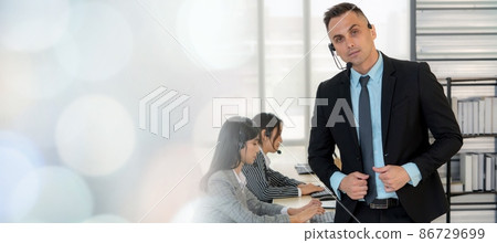 Business people wearing headset working in office broaden view Business people wearing headset working in office broaden view 86729699