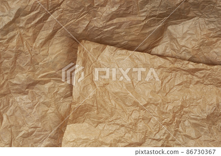 Crumpled craft brown paper texture for background Crumpled craft brown paper texture for background 86730367
