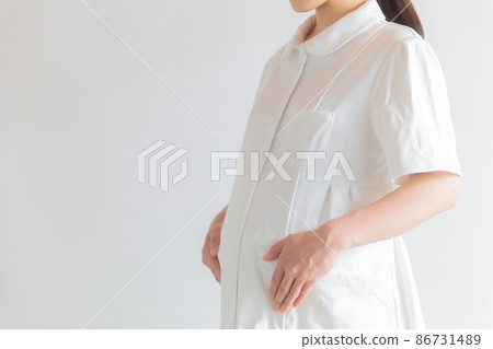 Working pregnant nurses copy space 86731489