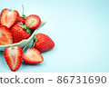 Top view of red strawberry on pastel background with copy space. 86731690