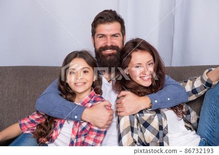 happy parents with kid girl at home. mom dad and daughter love relax together. 86732193
