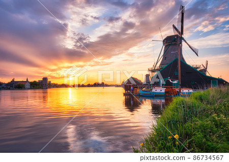 Windmills at Zaanse Schans in Holland on sunset. Zaandam, Nether Windmills at Zaanse Schans in Holland on sunset. Zaandam, Nether 86734567