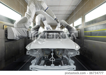 Car bodies are on assembly line. Modern automotive industry. A car being painted in a high-tech Car bodies are on assembly line. Modern automotive industry. A car being painted in a high-tech 86734777