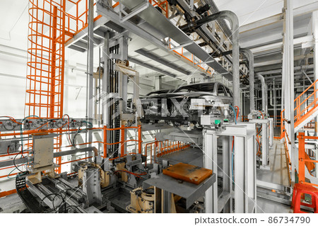 Automobile production line. Welding car body. Modern car assembly plant. Auto industry. Interior of Automobile production line. Welding car body. Modern car assembly plant. Auto industry. Interior of 86734790