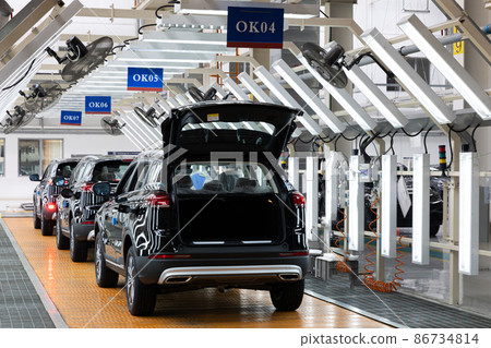 Photo of automobile production line. Welding car bodies. Modern car assembly plant. Auto industry 86734814