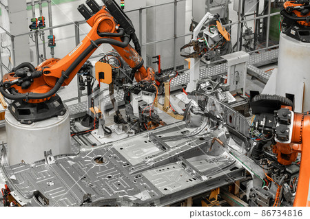 Photo of automobile production line. Welding car body. Modern car assembly plant. Auto industry 86734816